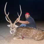 man with spotted deer