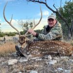 man with spotted deer daylight