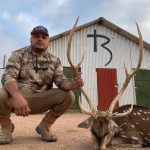 man with spotted deer RB background