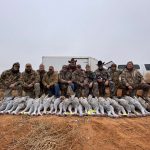 group shot of birds and men