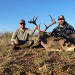 2 men with dead deer