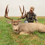 man with mule deer