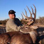 man with dead deer